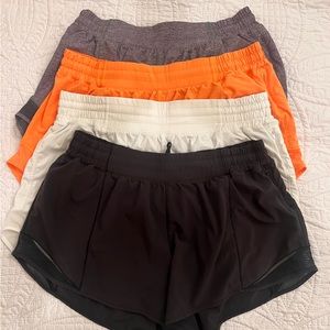 Lululemon Size 14 shorts, Set of 4-Black, White, Orange, Grey